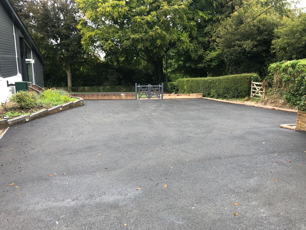 This is a photo of a bitumen driveway which is in the process of being installed by Gawler Road Tech SA